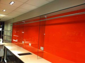 Orange glass splashback for shop display - Glass360.co.uk